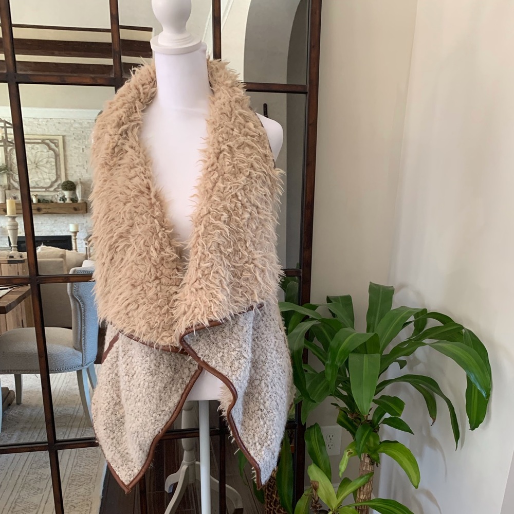 Shaggy Sherpa and wool vest with faux leather trim.